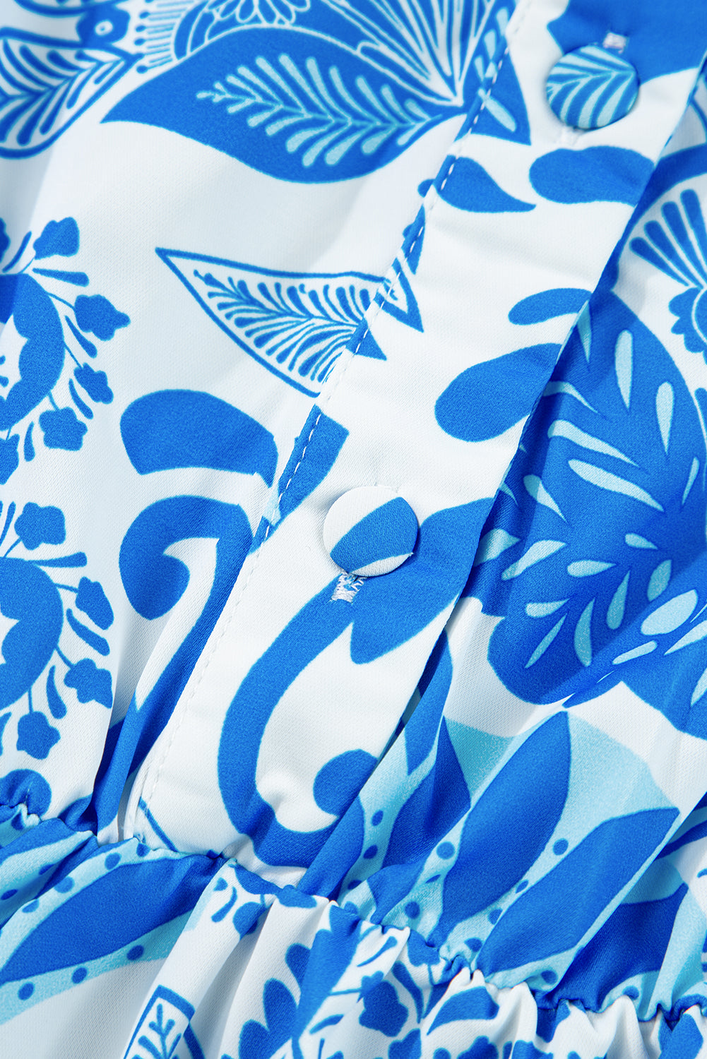 Sky blue mini dress with retro floral print, featuring a drawstring waist and ruffled hem, perfect for casual outings.