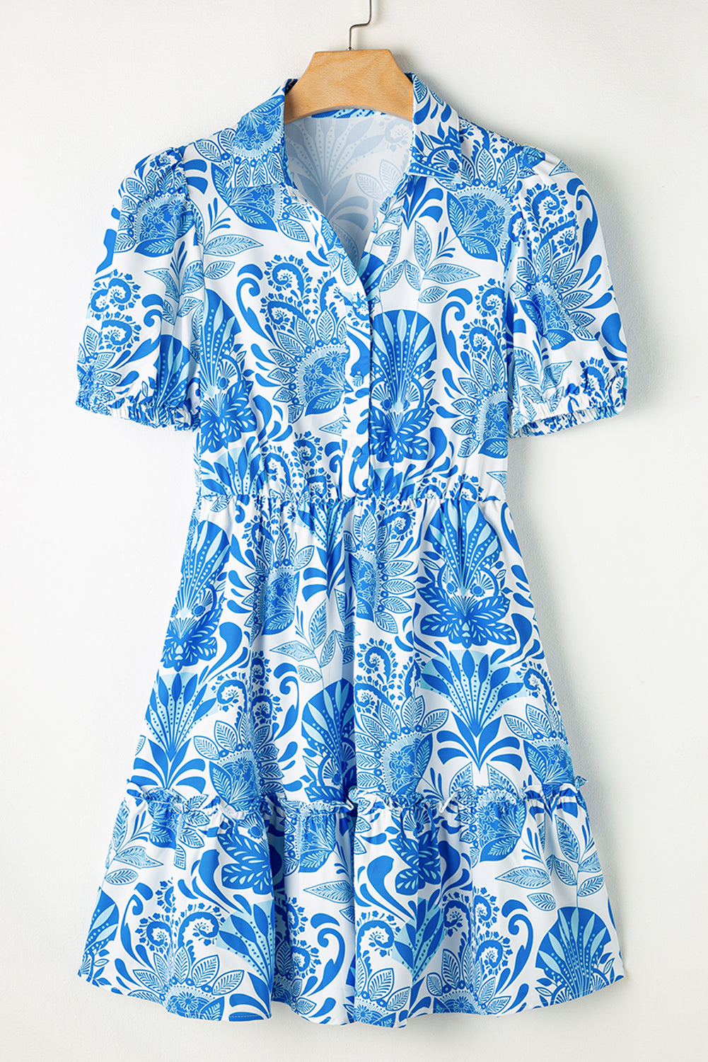 Sky blue mini dress with retro floral print, featuring a drawstring waist and ruffled hem, perfect for casual outings.