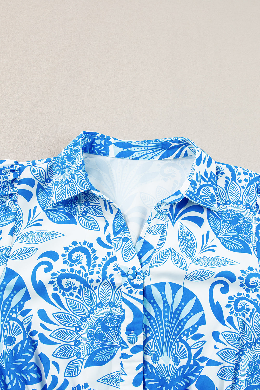 Sky blue mini dress with retro floral print, featuring a drawstring waist and ruffled hem, perfect for casual outings.