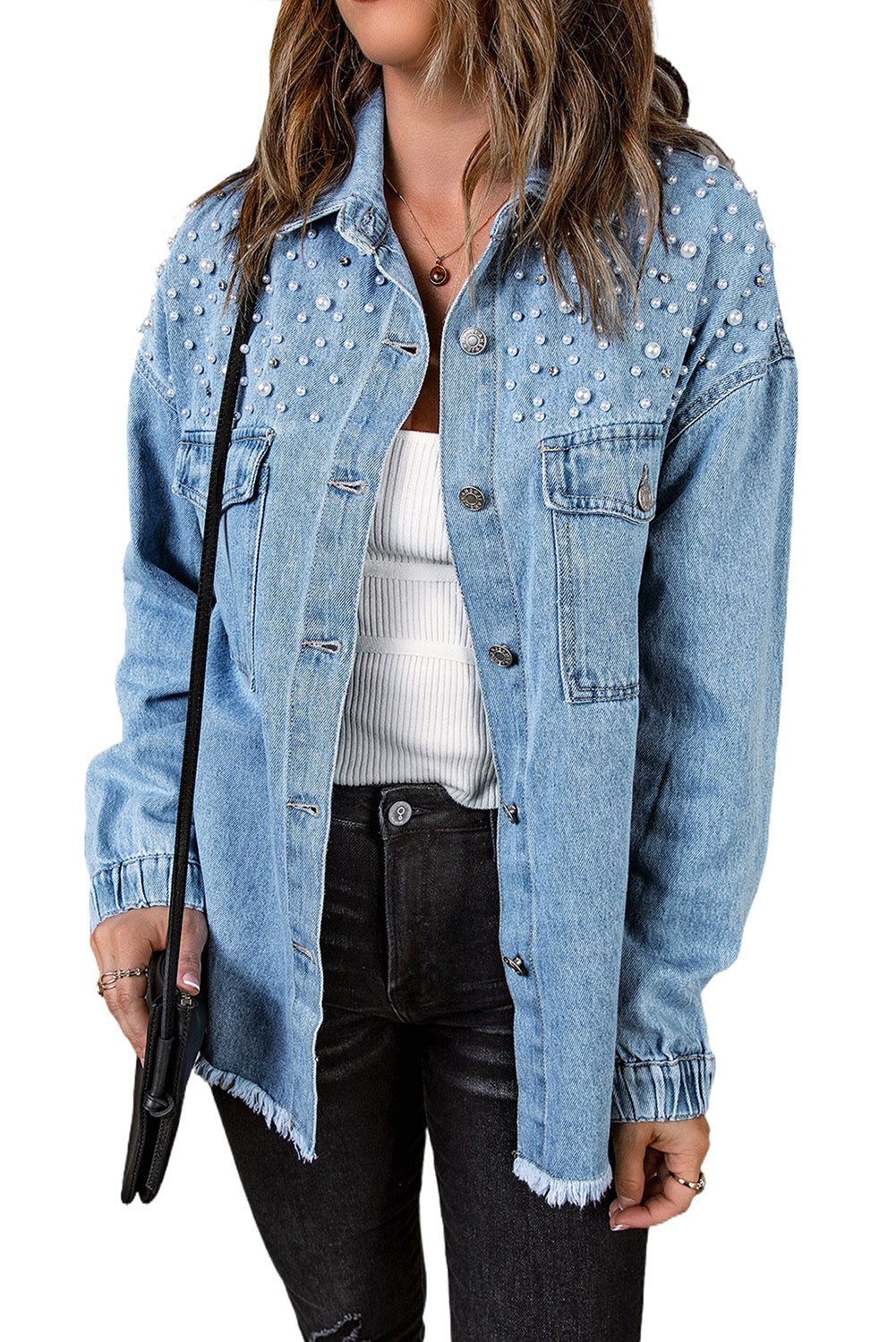 Sky blue denim shacket embellished with rhinestones and pearls, featuring a raw hemline and flap pockets.