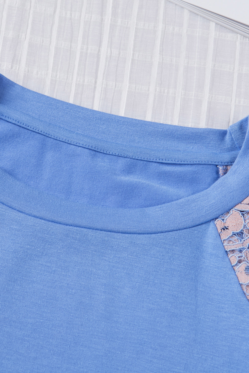 Sky Blue Tiered Lace Sleeve Knit Top featuring elegant lace splicing and a comfortable crew neck design.
