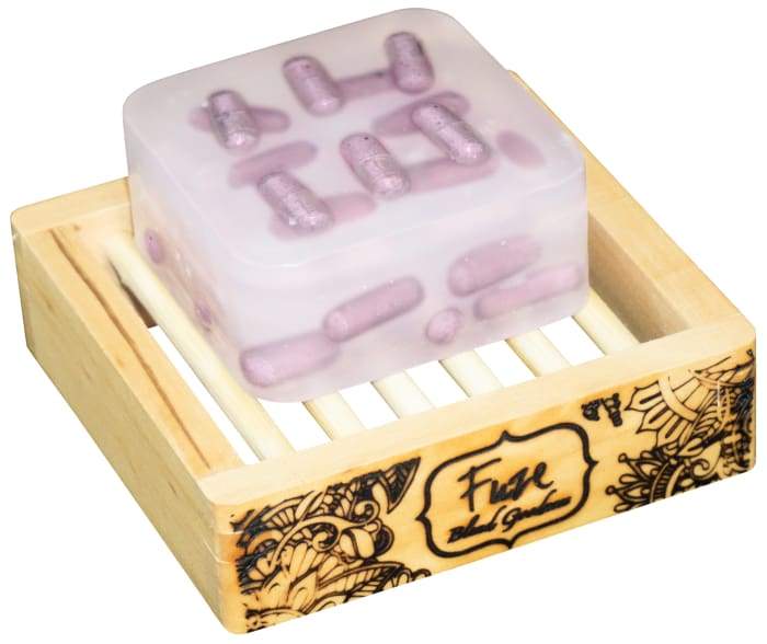 A Sleep Burst Bar with essential oil pockets and a wooden soap dish, designed for a relaxing bath experience.