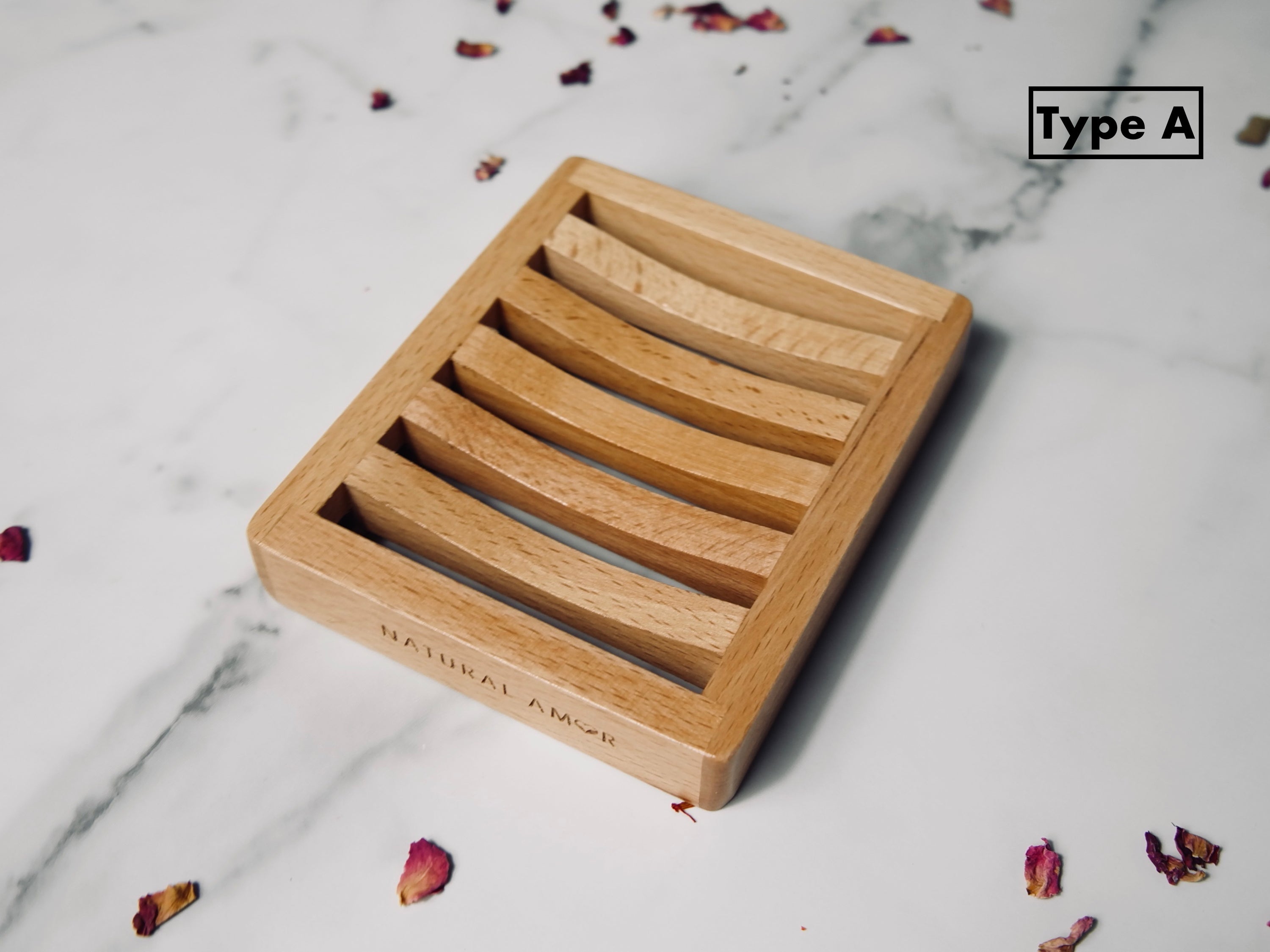 Natural wood soap dish designed to keep soap dry, featuring drainage holes and a sleek finish.