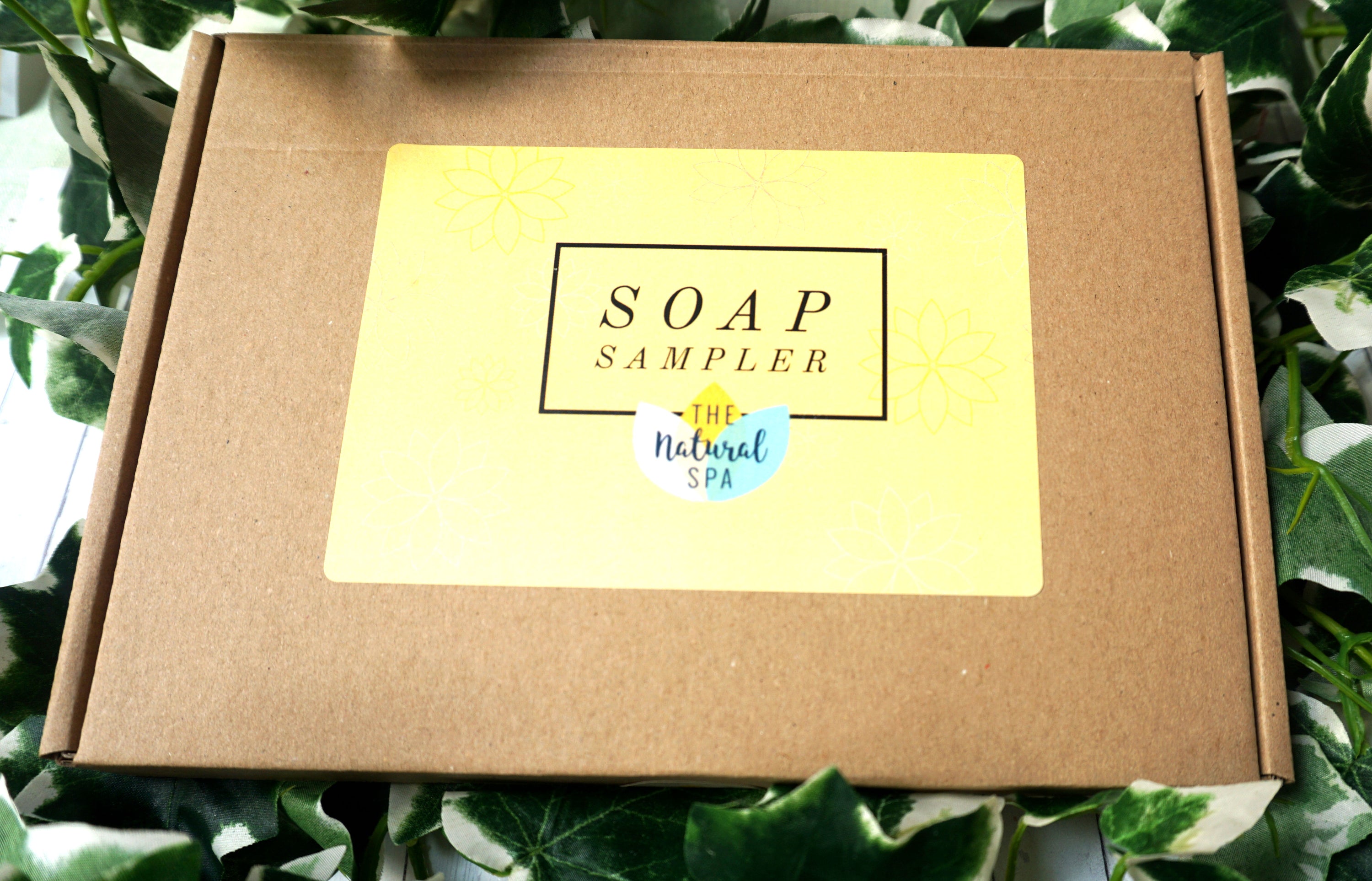 Soap Sampler Gift Set featuring 8 mini travel soaps in a letterbox-sized package, showcasing various colors and textures.