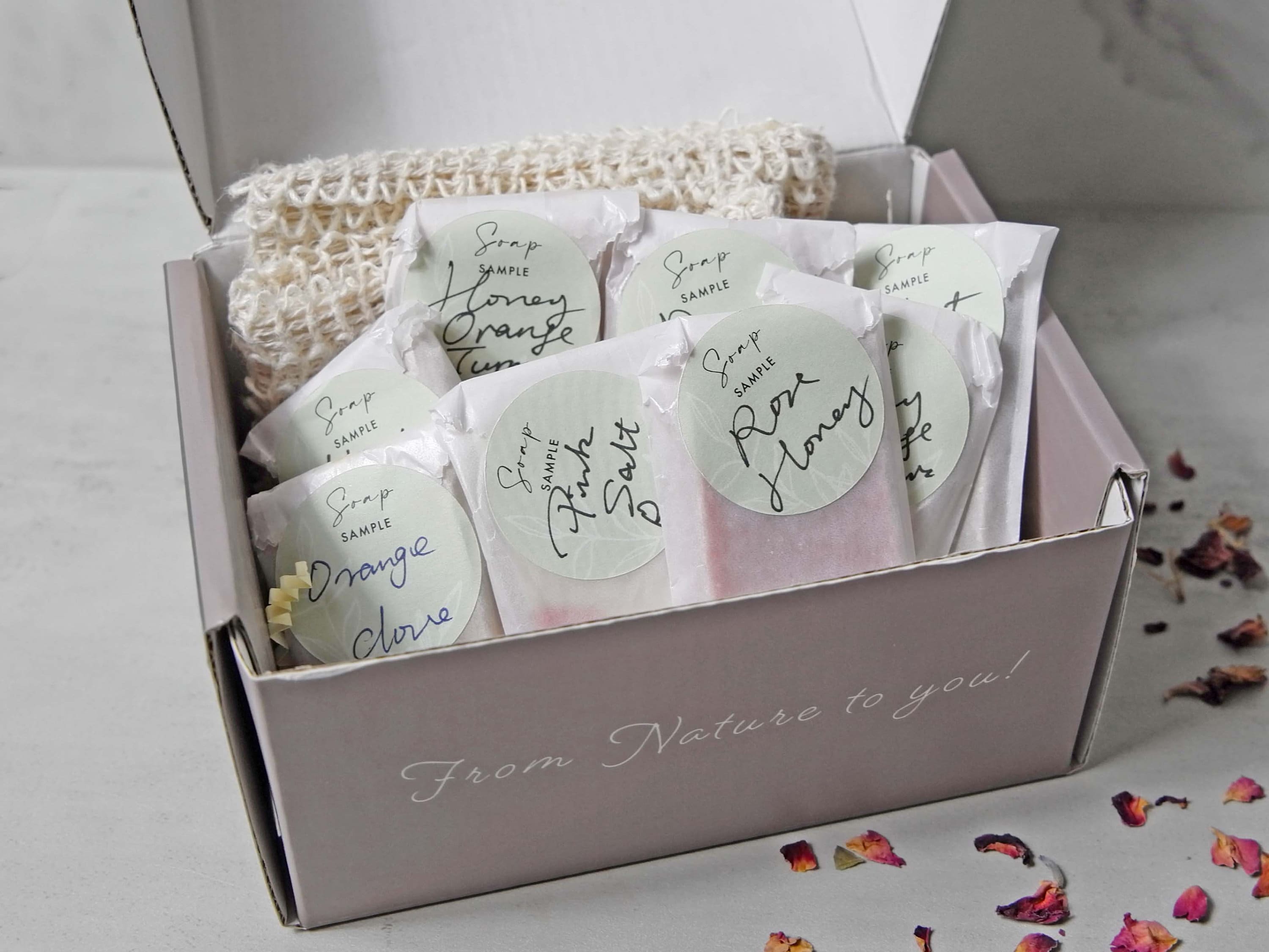 A collection of assorted soap samples in various scents, each approximately 0.5 oz, displayed attractively for potential buyers.