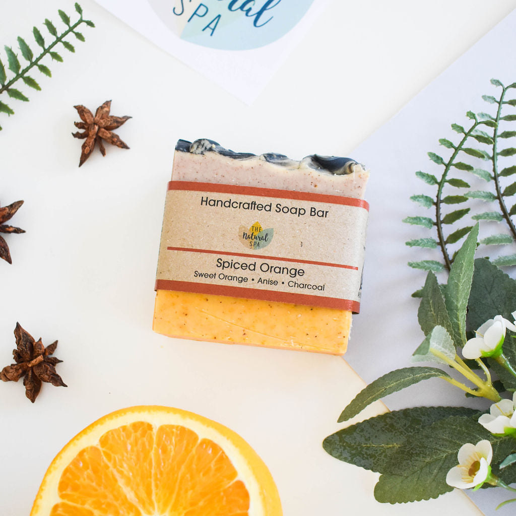 Handmade Spiced Orange Soap Bar featuring sweet orange and star anise, showcasing unique swirls and natural ingredients.