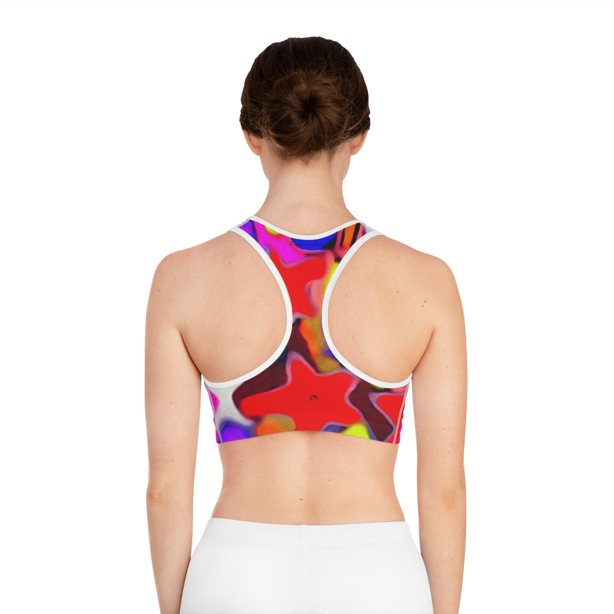 A stylish sports bra featuring an all-over print design, showcasing its comfortable fit and moisture-wicking fabric, perfect for workouts.