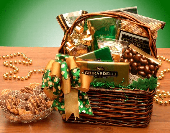 A beautifully arranged St. Patrick's Luck O The Irish Gourmet Treats basket filled with snacks, chocolates, and coffee.