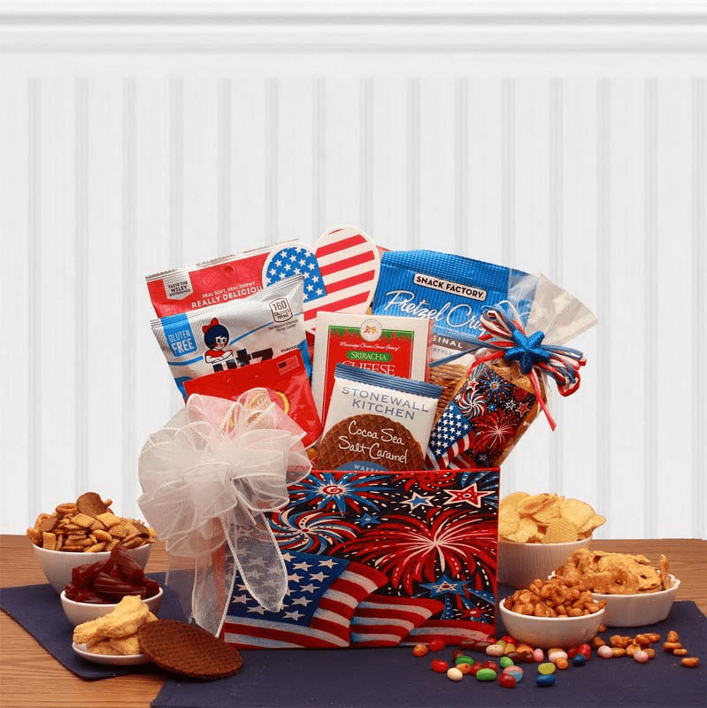 Stars & Stripes Forever Patriotic Gift Box filled with assorted snacks, wrapped in cellophane with a handmade bow, perfect for July 4th celebrations.