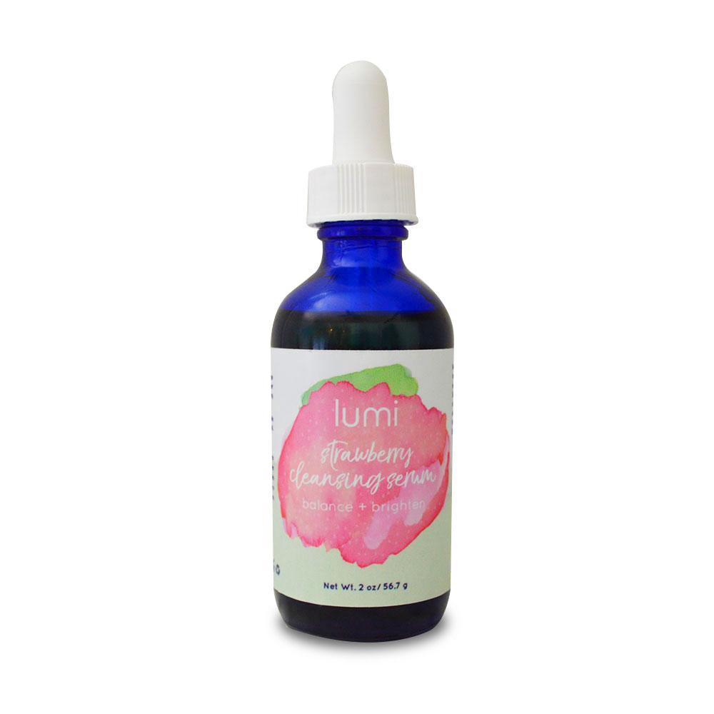 A bottle of Strawberry Cleansing Serum with a vibrant label, surrounded by fresh strawberries and natural ingredients.