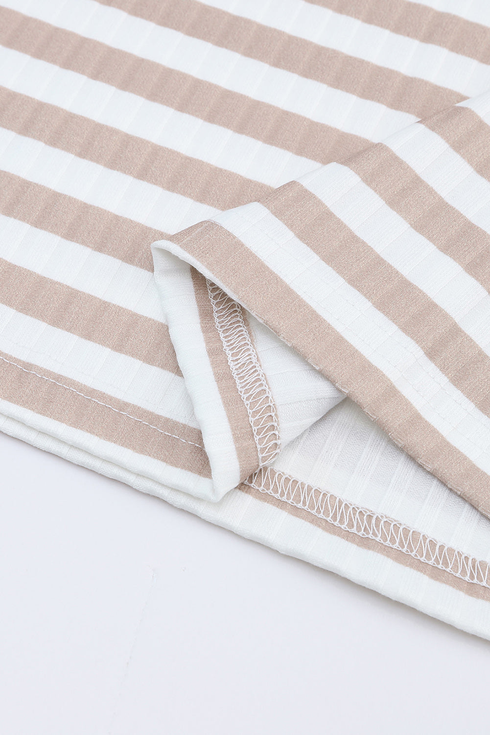 Strawberry pink striped long sleeve tee with textured knit fabric and high neck design, perfect for stylish layering.