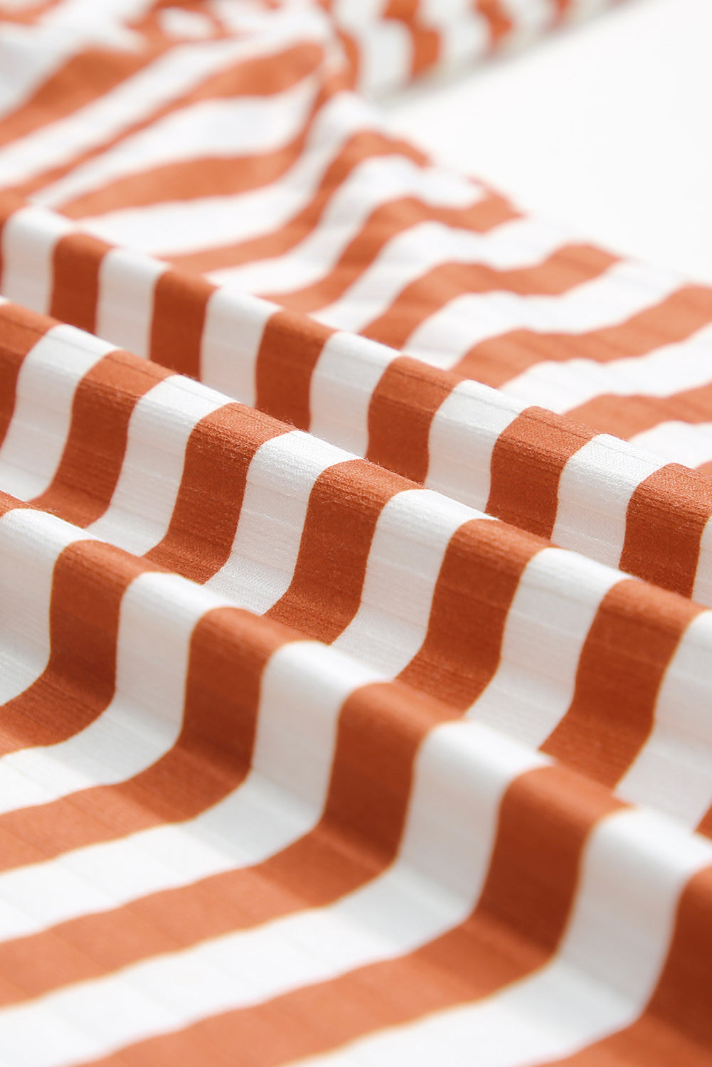 Strawberry pink striped long sleeve tee with textured knit fabric and high neck design, perfect for stylish layering.