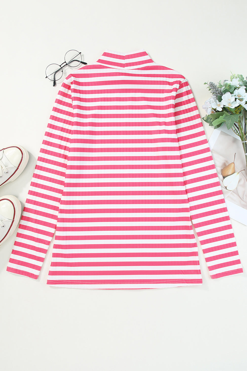 Strawberry pink striped long sleeve tee with textured knit fabric and high neck design, perfect for stylish layering.