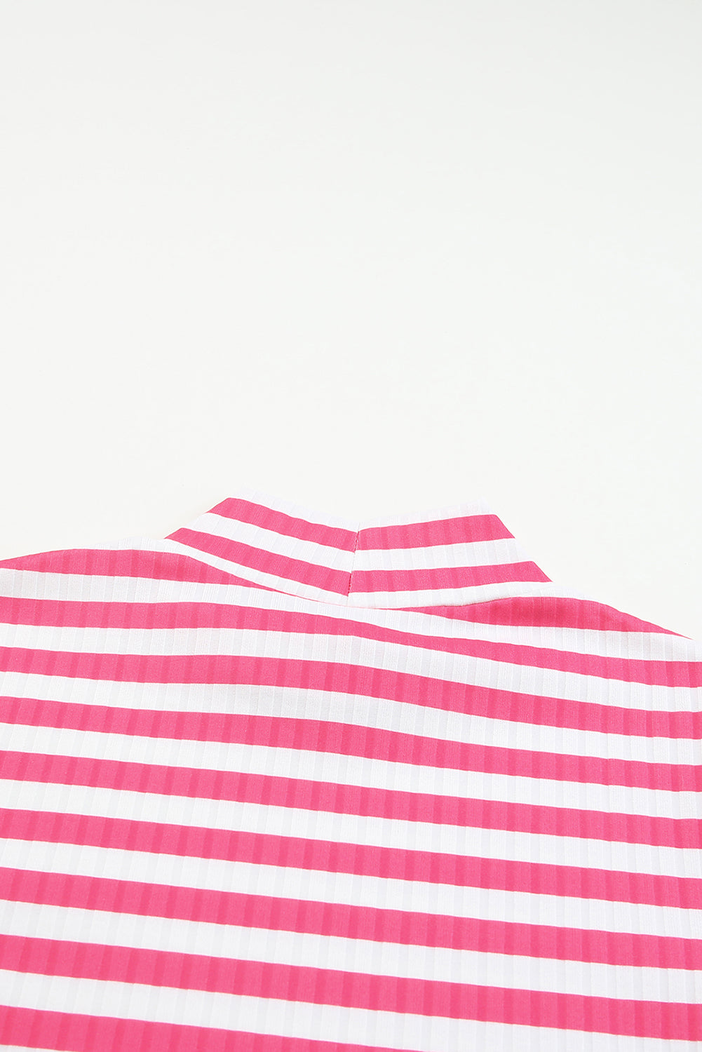 Strawberry pink striped long sleeve tee with textured knit fabric and high neck design, perfect for stylish layering.
