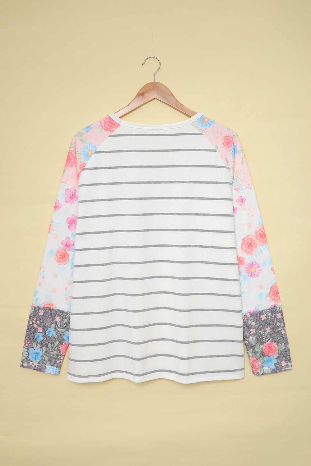 A stylish plus size floral long sleeve top featuring a stripe print design, perfect for casual and formal occasions.