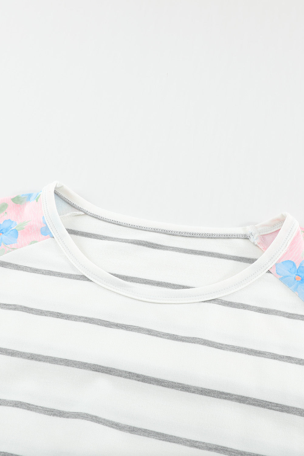 A stylish plus size floral long sleeve top featuring a stripe print design, perfect for casual and formal occasions.