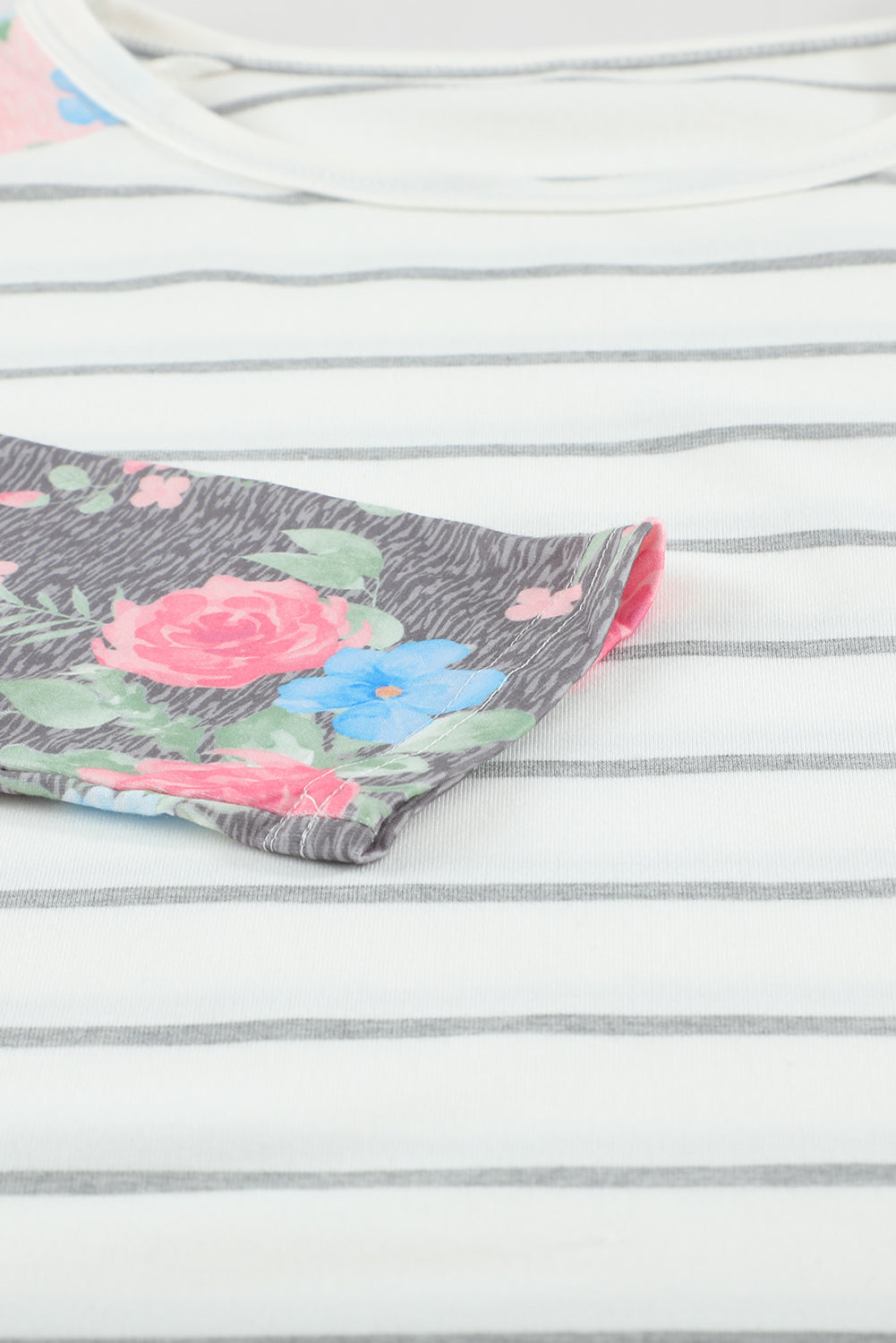 A stylish plus size floral long sleeve top featuring a stripe print design, perfect for casual and formal occasions.