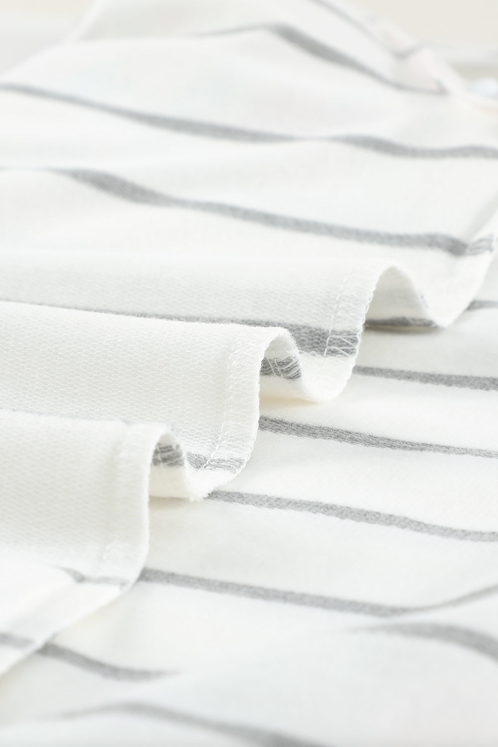 A stylish plus size floral long sleeve top featuring a stripe print design, perfect for casual and formal occasions.