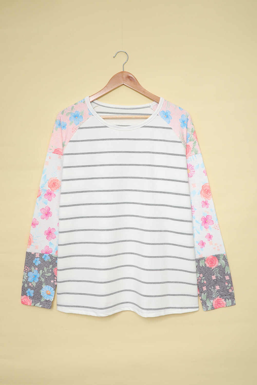 A stylish plus size floral long sleeve top featuring a stripe print design, perfect for casual and formal occasions.