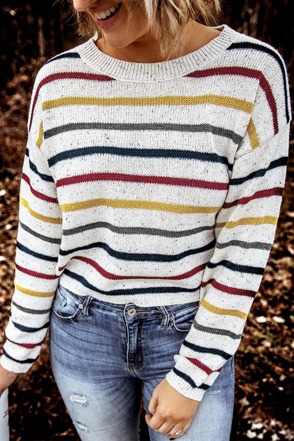 A stylish heathery grey knit sweater featuring colorful stripes, crew neck, and long drop sleeves, perfect for chilly weather.