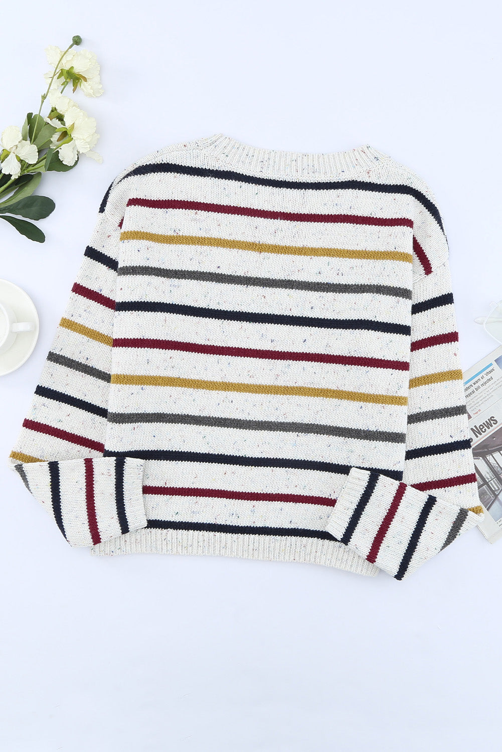 A stylish heathery grey knit sweater featuring colorful stripes, crew neck, and long drop sleeves, perfect for chilly weather.