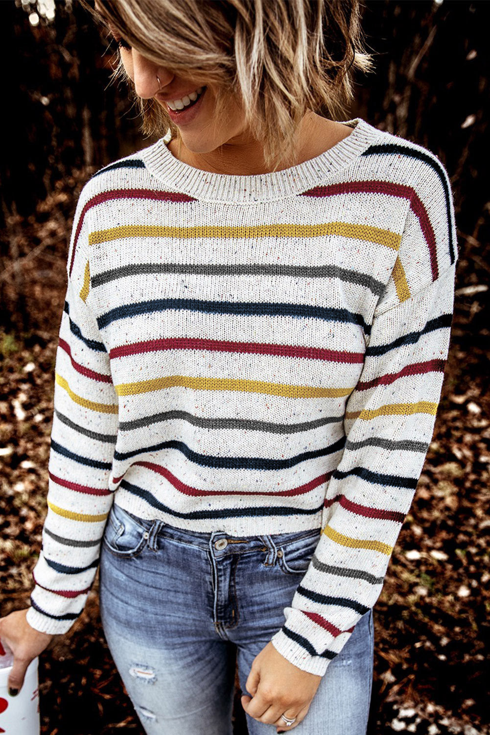 A stylish heathery grey knit sweater featuring colorful stripes, crew neck, and long drop sleeves, perfect for chilly weather.