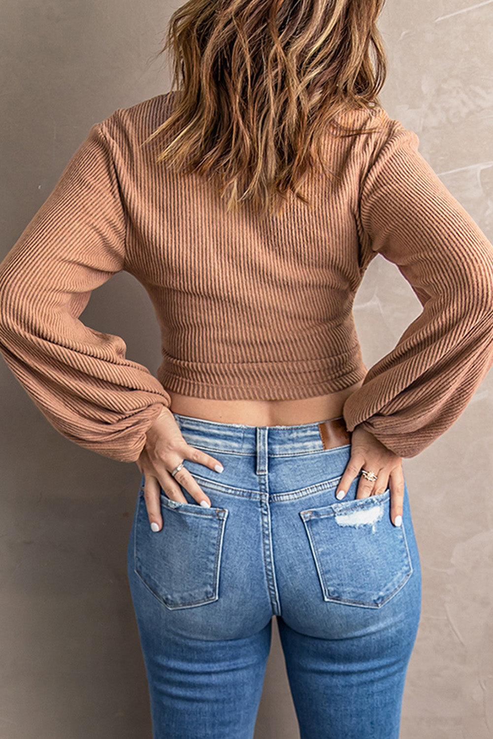 Surplice Ribbed Bubble Sleeve Crop Top featuring a flattering faux wrap design, long bubble sleeves, and a stylish ribbed fabric.