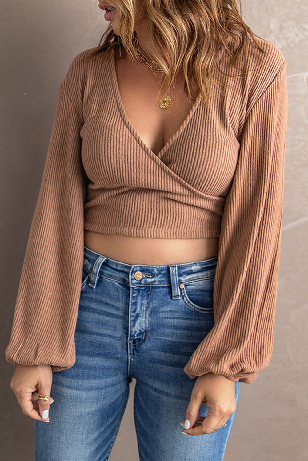 Surplice Ribbed Bubble Sleeve Crop Top featuring a flattering faux wrap design, long bubble sleeves, and a stylish ribbed fabric.
