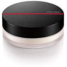 Shiseido Synchro Skin Invisible Silk Loose Powder in a sleek container, showcasing its fine texture and matte finish.