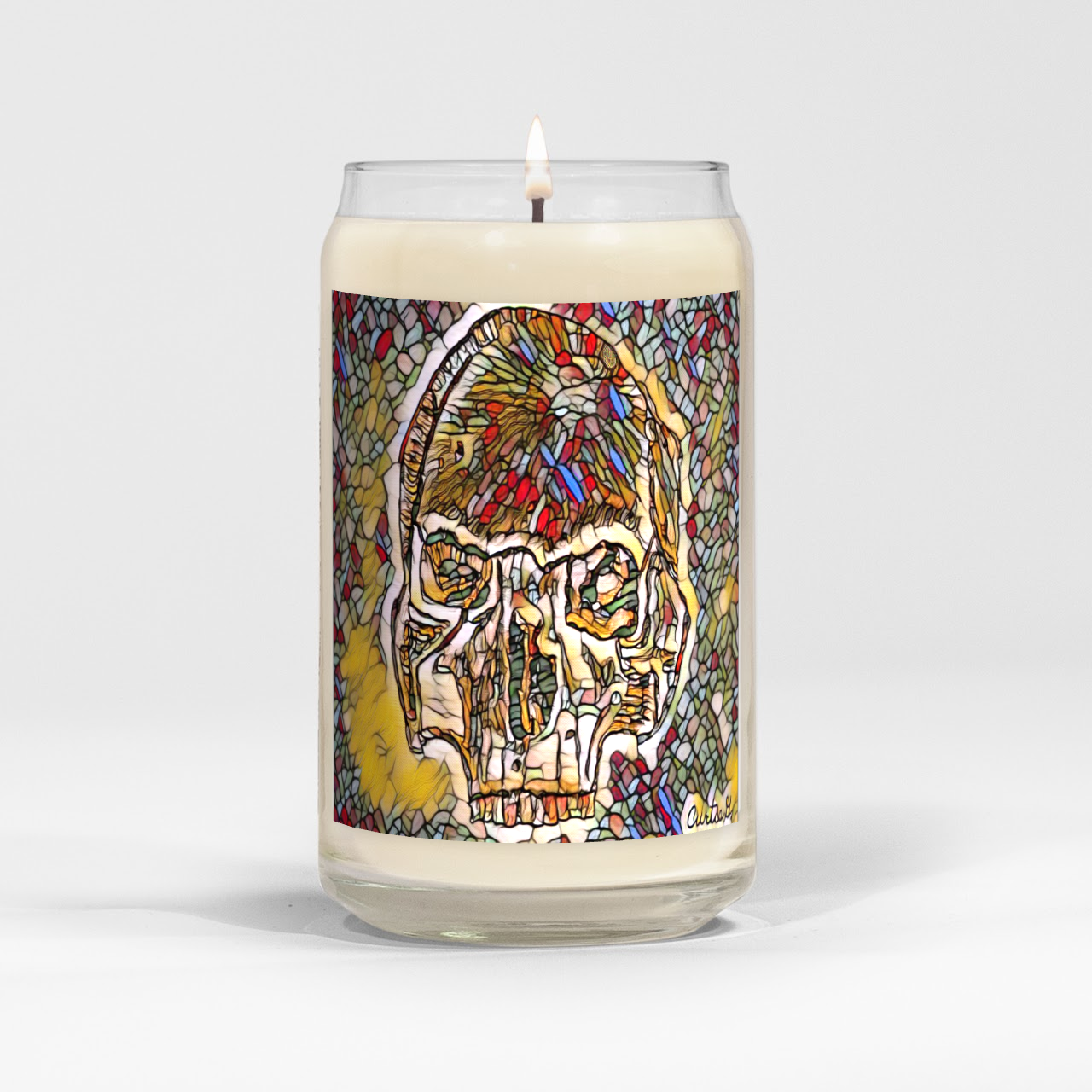 A beautifully crafted skull-shaped candle in a clear vessel, showcasing its unique design and natural soy wax blend.
