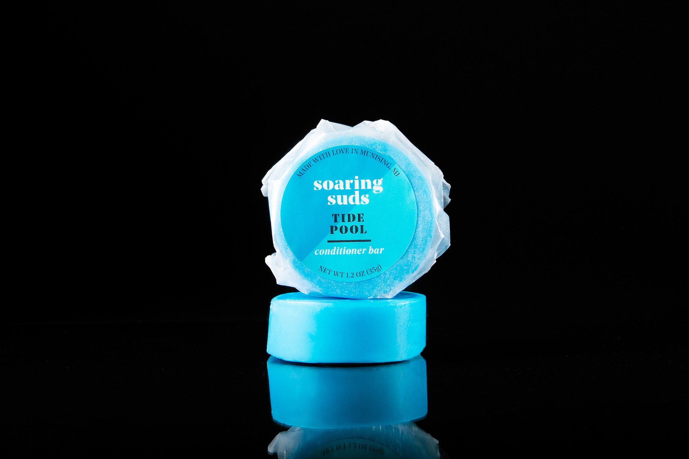 Tide Pool Shampoo & Conditioner bars with spearmint, sage, and eucalyptus scent, showcasing their eco-friendly packaging and moisturizing ingredients.