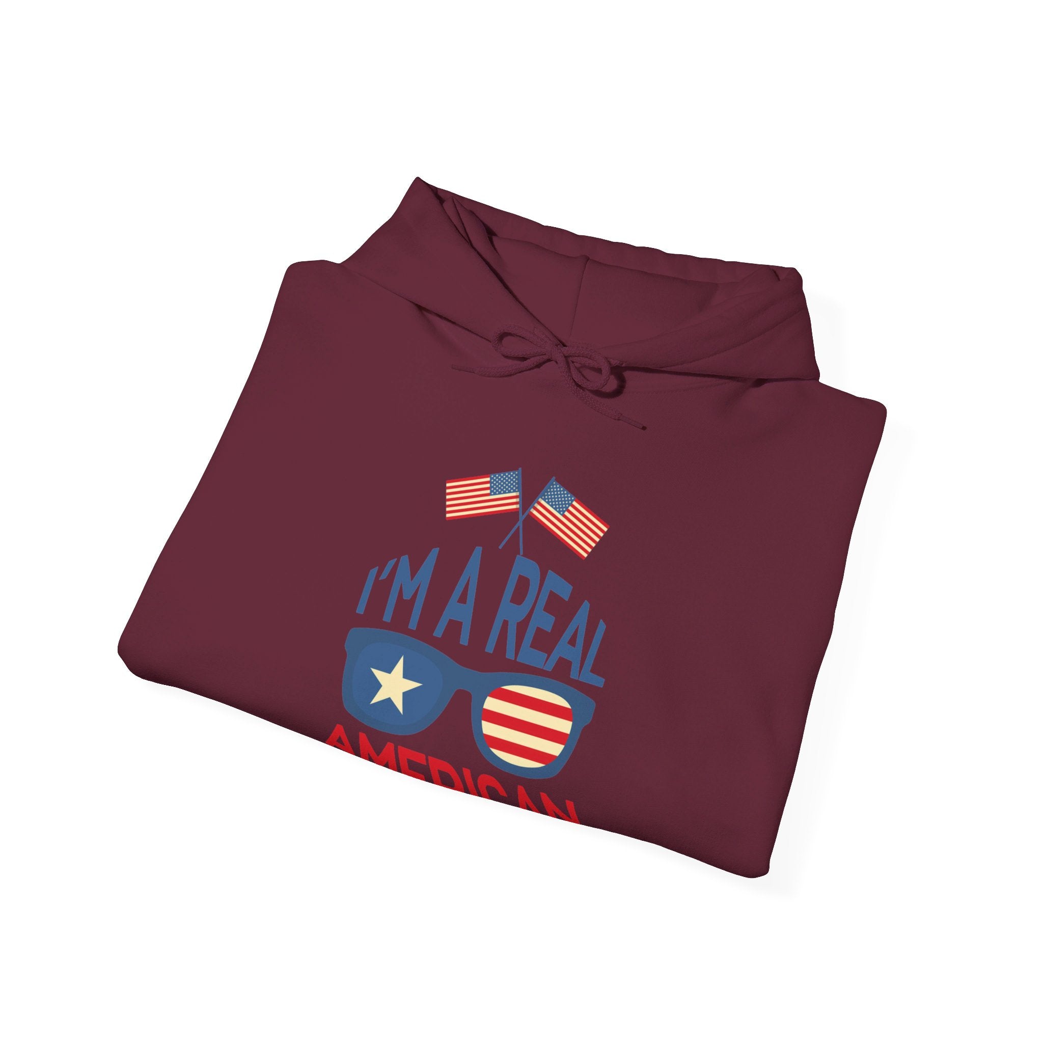 Unisex Heavy Blend Hooded Sweatshirt featuring 'A Real American' design, showcasing a cozy fit with a kangaroo pocket and stylish drawstring.