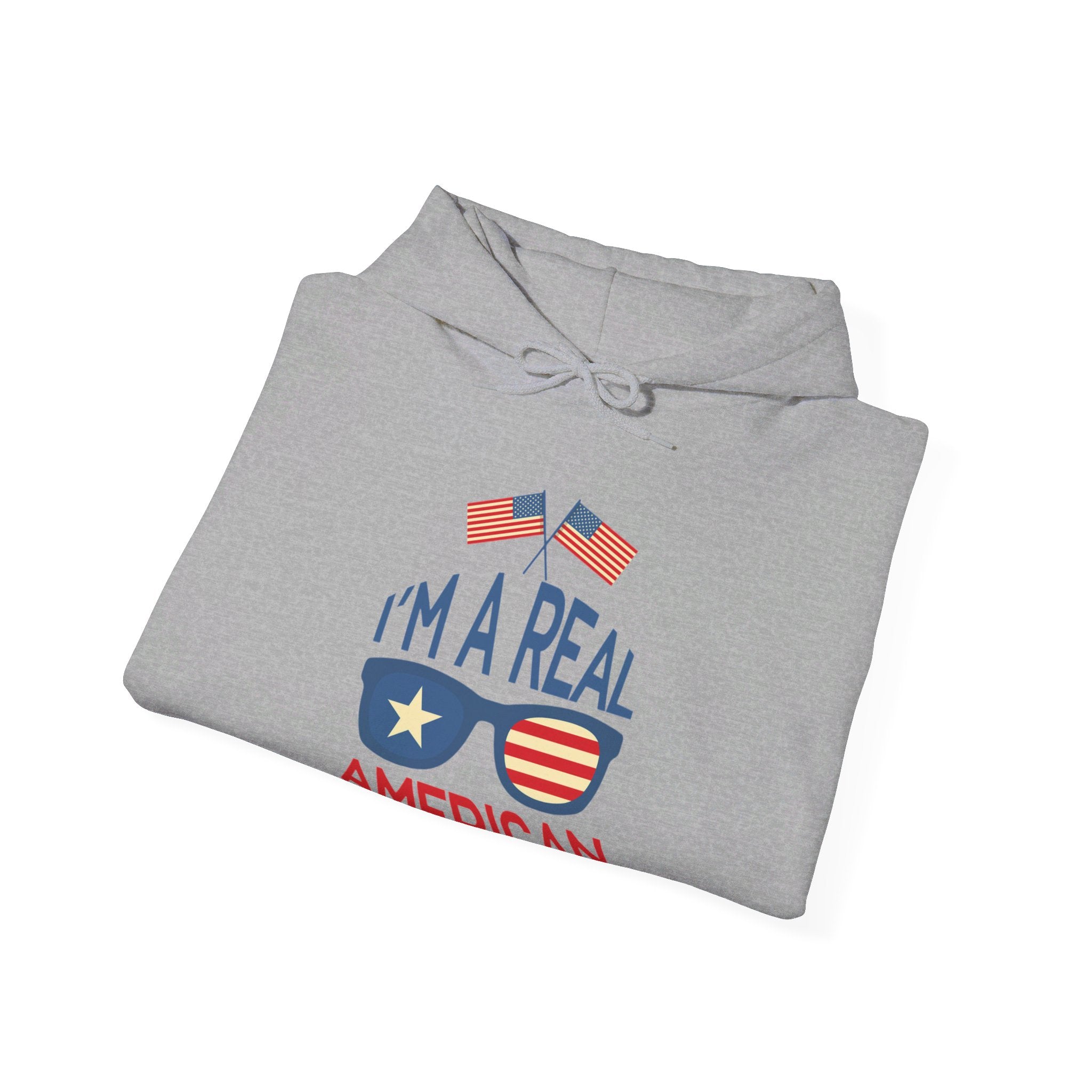 Unisex Heavy Blend Hooded Sweatshirt featuring 'A Real American' design, showcasing a cozy fit with a kangaroo pocket and stylish drawstring.