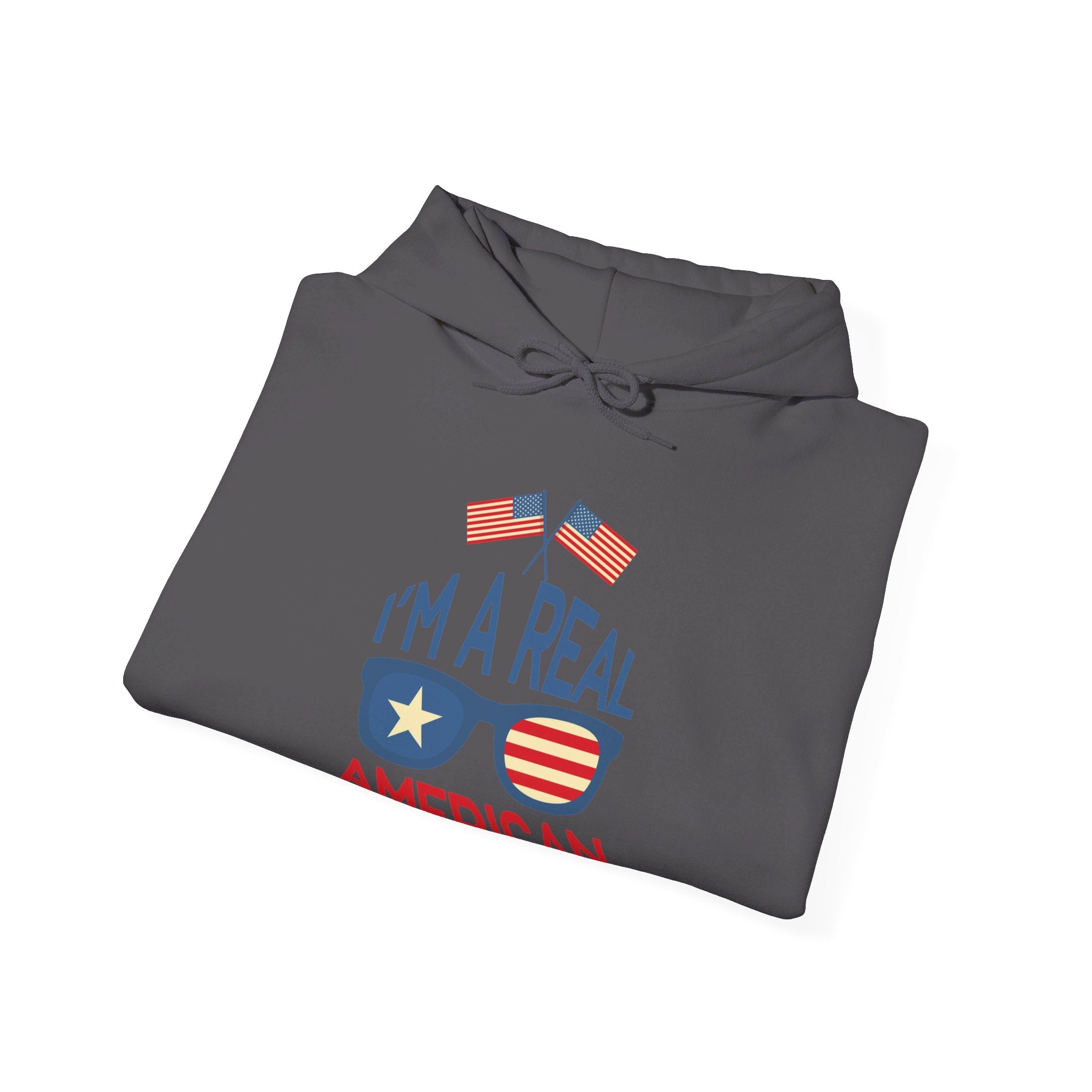 Unisex Heavy Blend Hooded Sweatshirt featuring 'A Real American' design, showcasing a cozy fit with a kangaroo pocket and stylish drawstring.