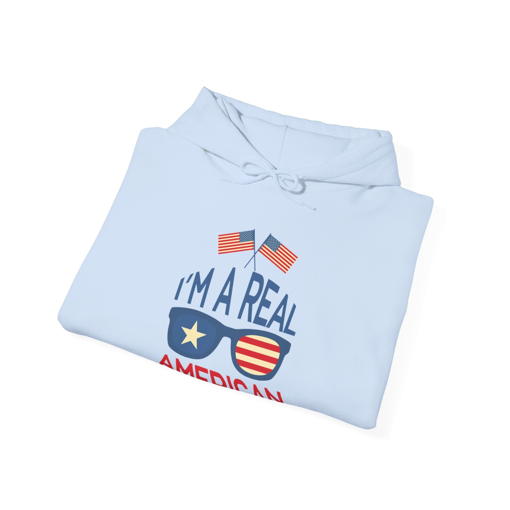 Unisex Heavy Blend Hooded Sweatshirt featuring 'A Real American' design, showcasing a cozy fit with a kangaroo pocket and stylish drawstring.