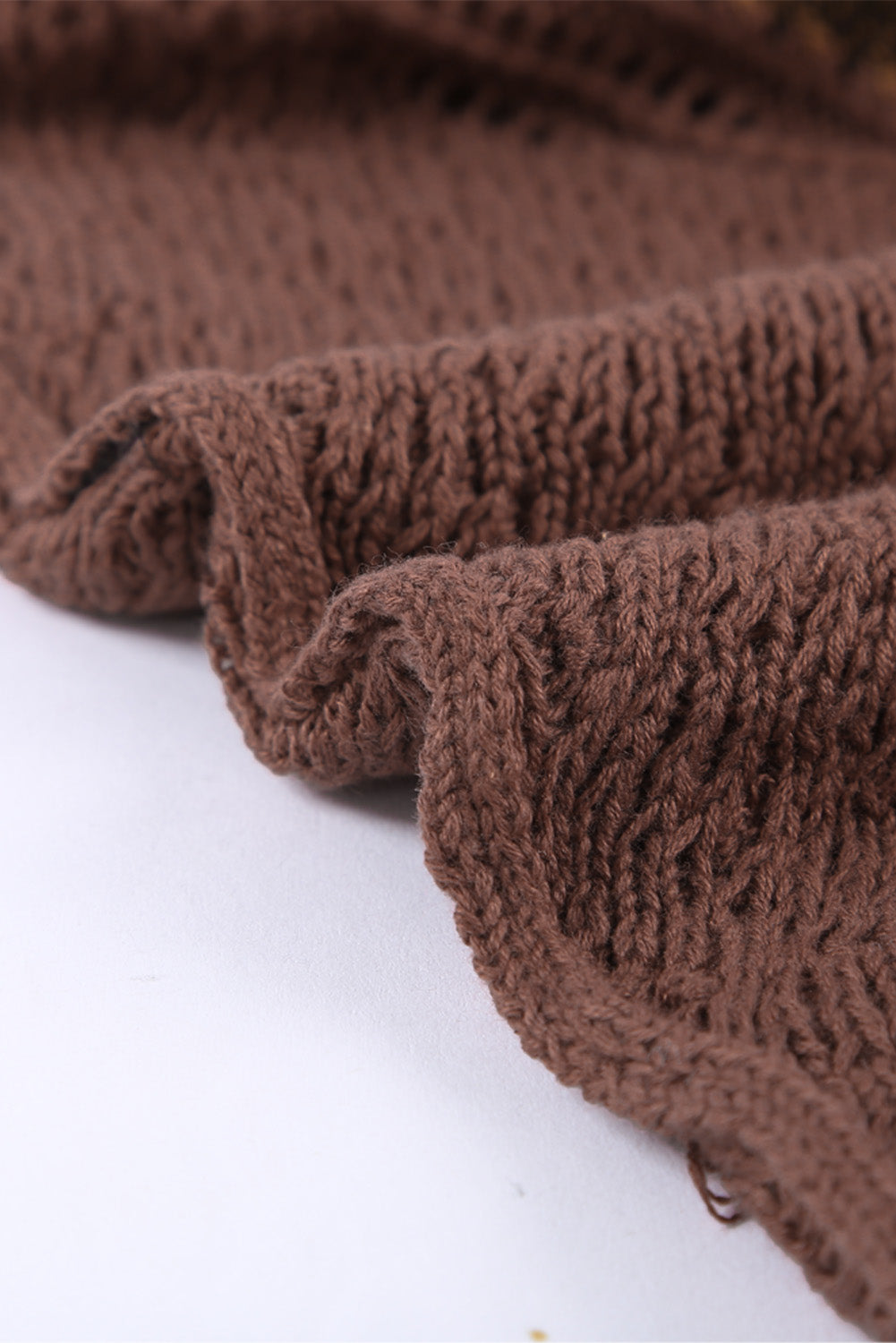 A stylish white asymmetrical sweater featuring a high neck, cold shoulder design, and buckle strap, perfect for chic outfits.