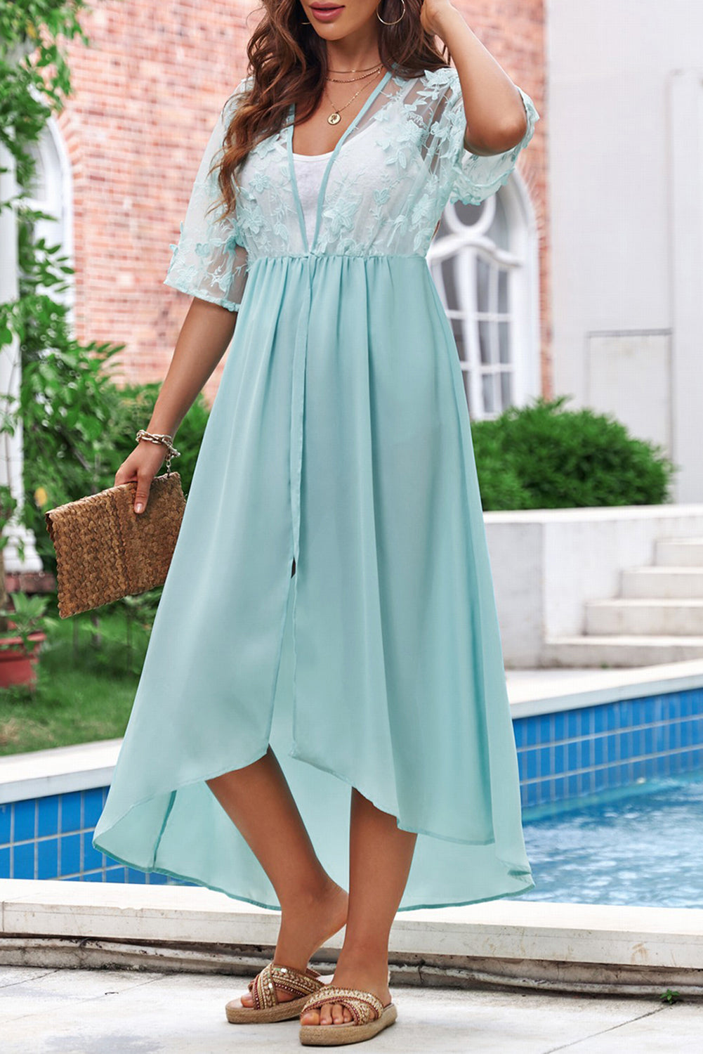 A beautiful white floral mesh lace crochet kimono with an open front, showcasing delicate lace details and a loose fit, perfect for summer wear.