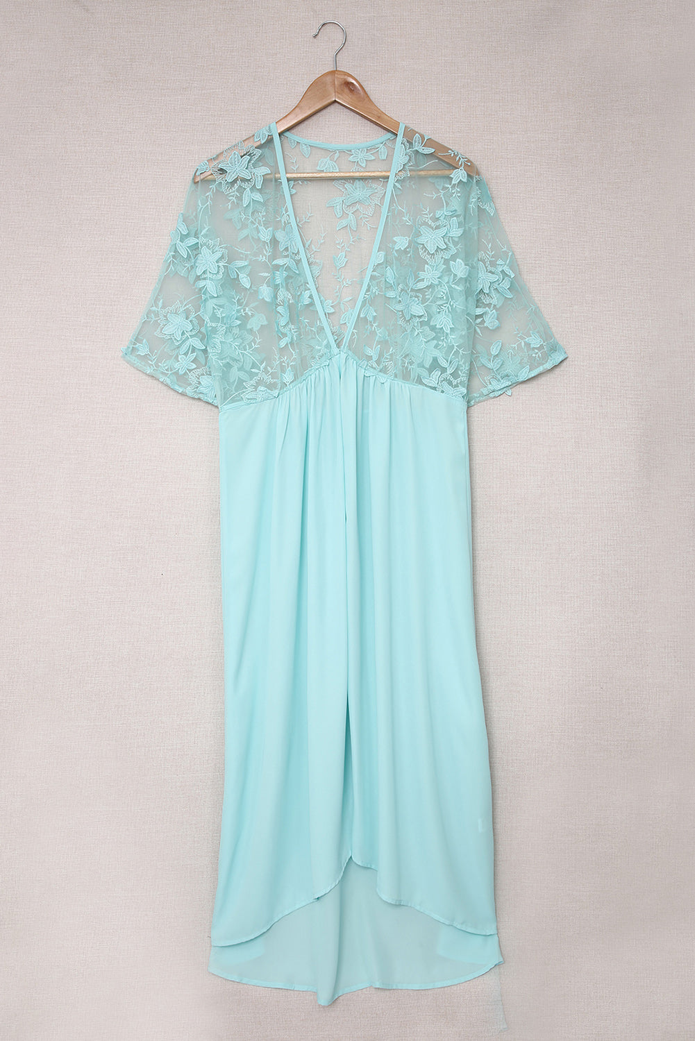 A beautiful white floral mesh lace crochet kimono with an open front, showcasing delicate lace details and a loose fit, perfect for summer wear.