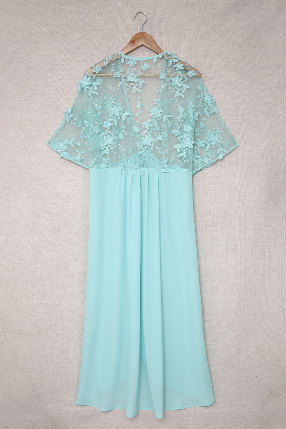 A beautiful white floral mesh lace crochet kimono with an open front, showcasing delicate lace details and a loose fit, perfect for summer wear.