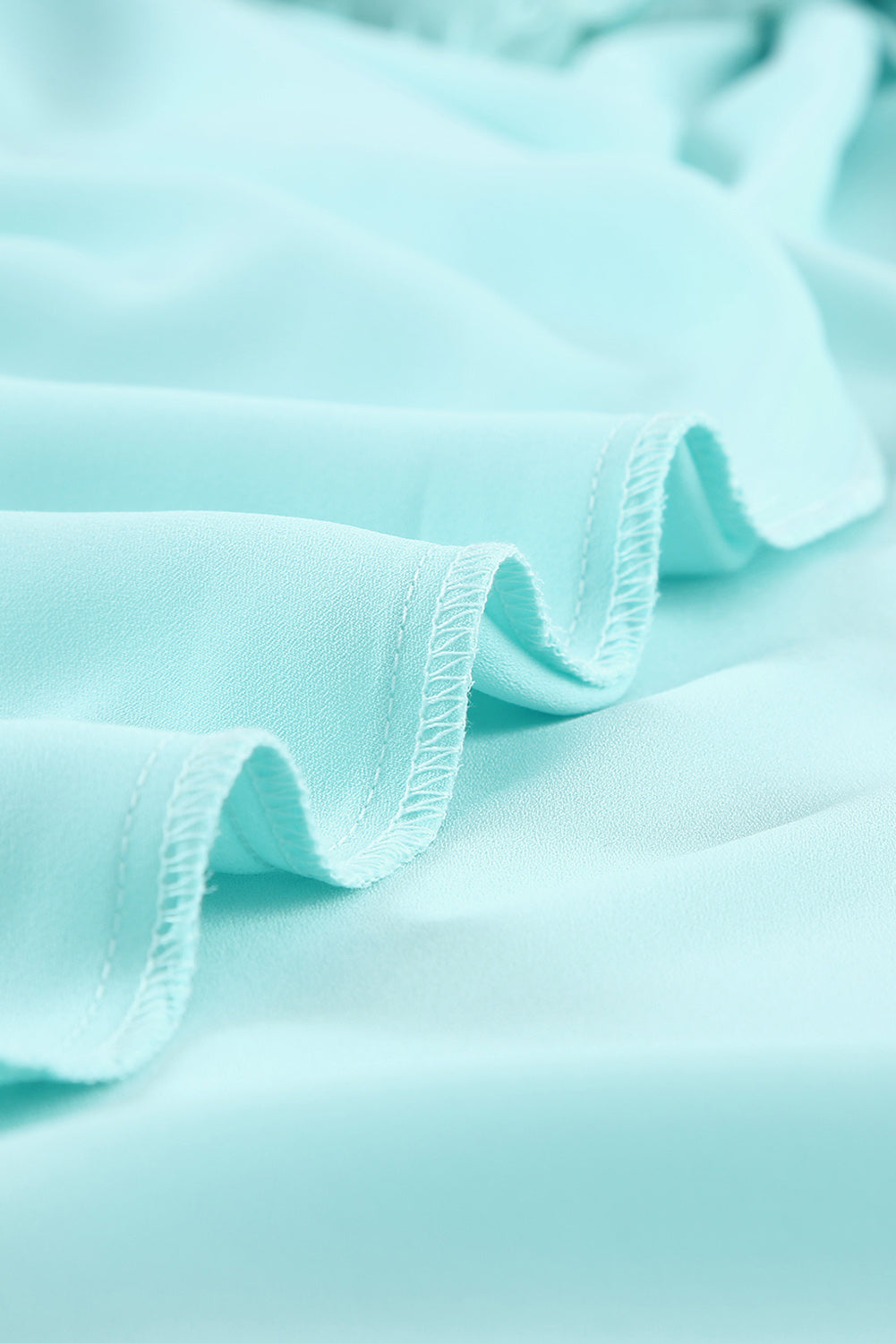 A beautiful white floral mesh lace crochet kimono with an open front, showcasing delicate lace details and a loose fit, perfect for summer wear.