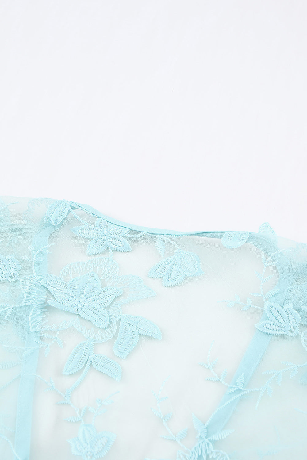 A beautiful white floral mesh lace crochet kimono with an open front, showcasing delicate lace details and a loose fit, perfect for summer wear.