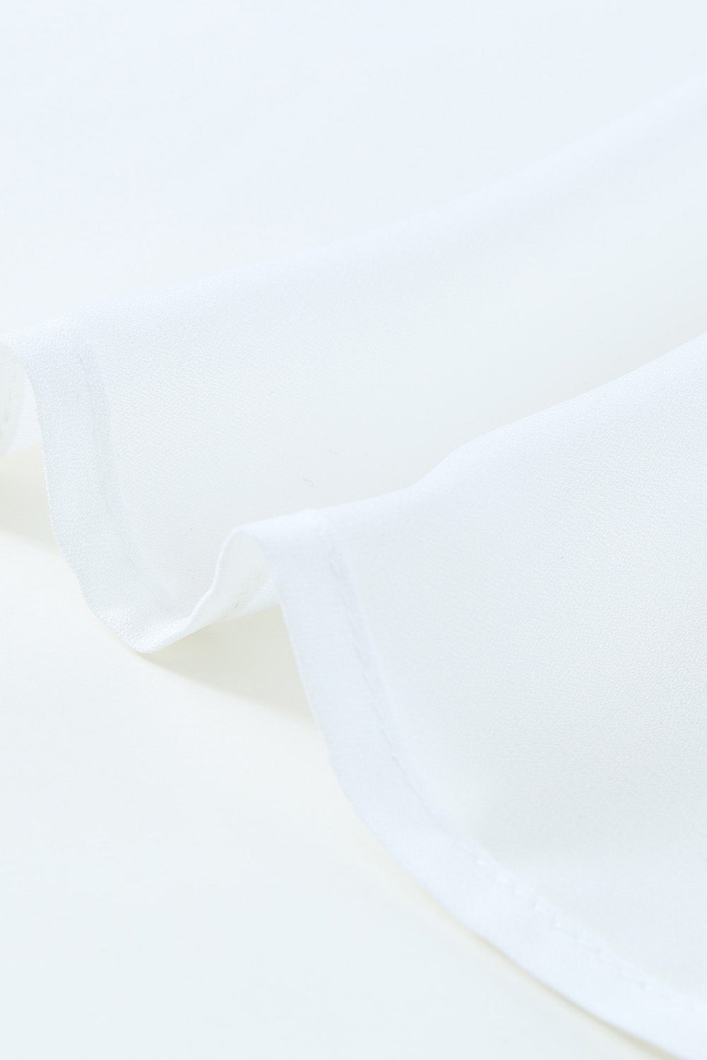 A beautiful white floral mesh lace crochet kimono with an open front, showcasing delicate lace details and a loose fit, perfect for summer wear.