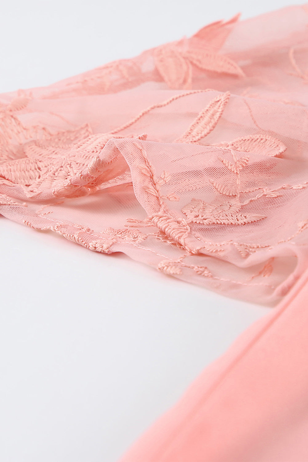 A beautiful white floral mesh lace crochet kimono with an open front, showcasing delicate lace details and a loose fit, perfect for summer wear.