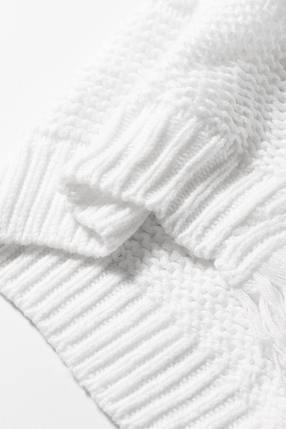 A stylish white long cardigan with fringed edges and open front, featuring two pockets, perfect for layering and adding elegance to any outfit.