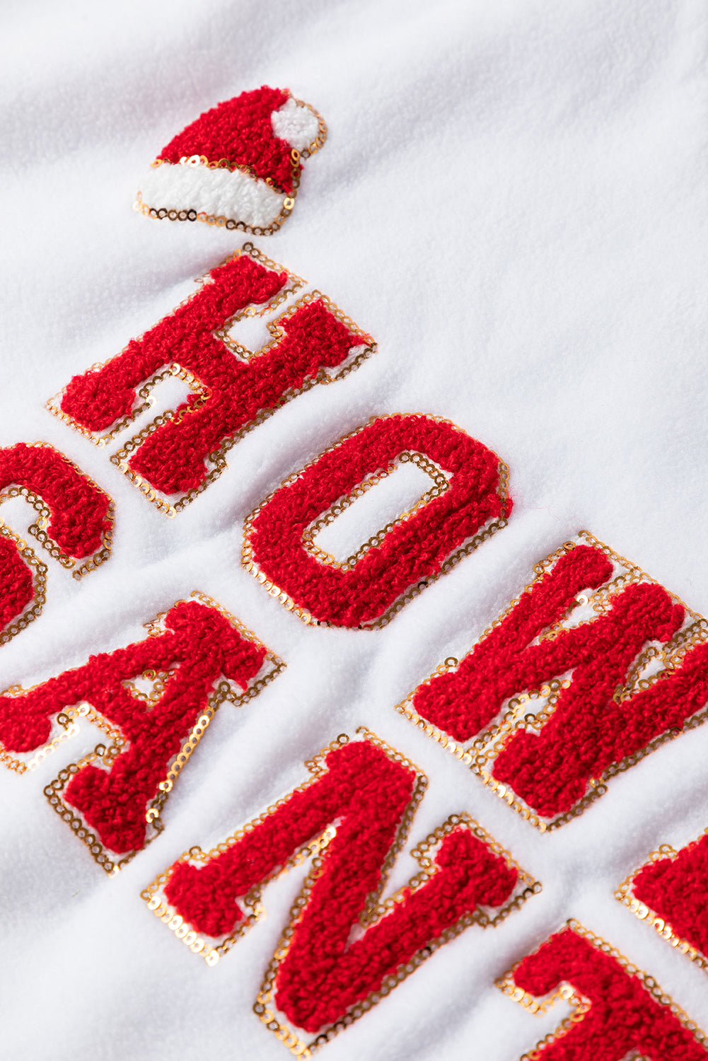A cozy white baggy sweatshirt featuring the festive HOWDY SANTA graphic in chenille letters, perfect for holiday celebrations.