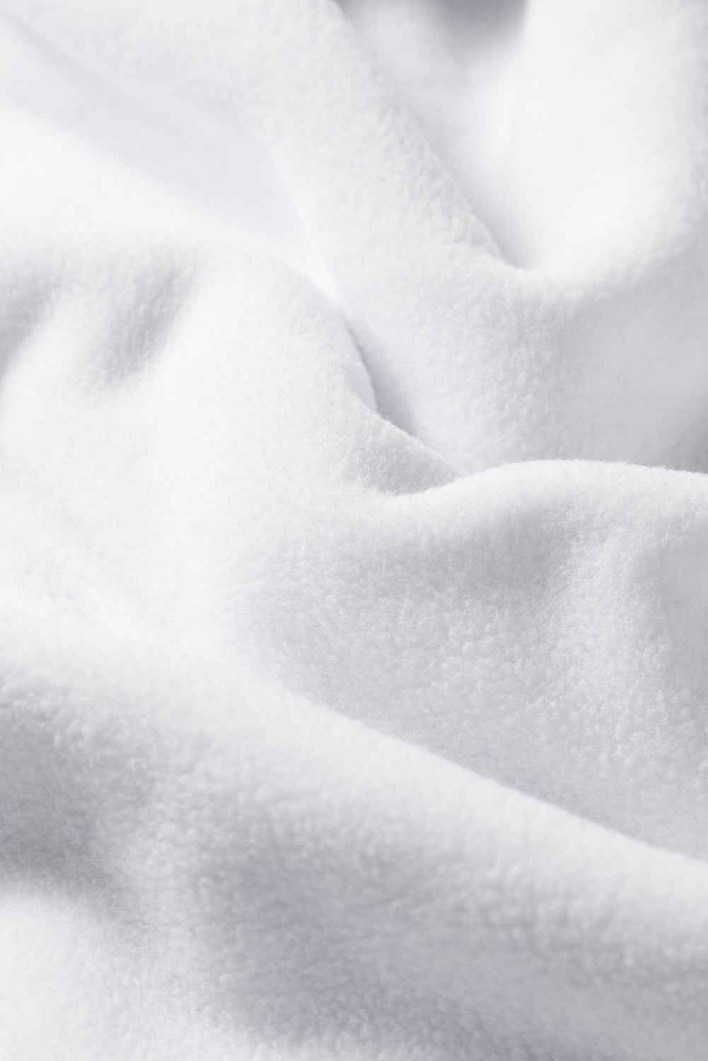 A cozy white baggy sweatshirt featuring the festive HOWDY SANTA graphic in chenille letters, perfect for holiday celebrations.