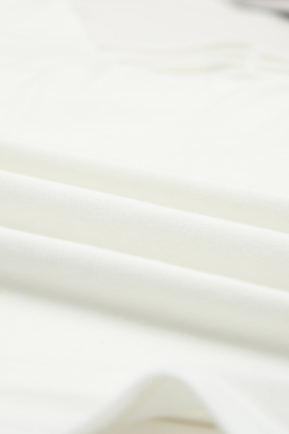 White lace-up hollow-out neck solid tank top showcasing a stylish design with a deep U-neck and sleeveless cut.