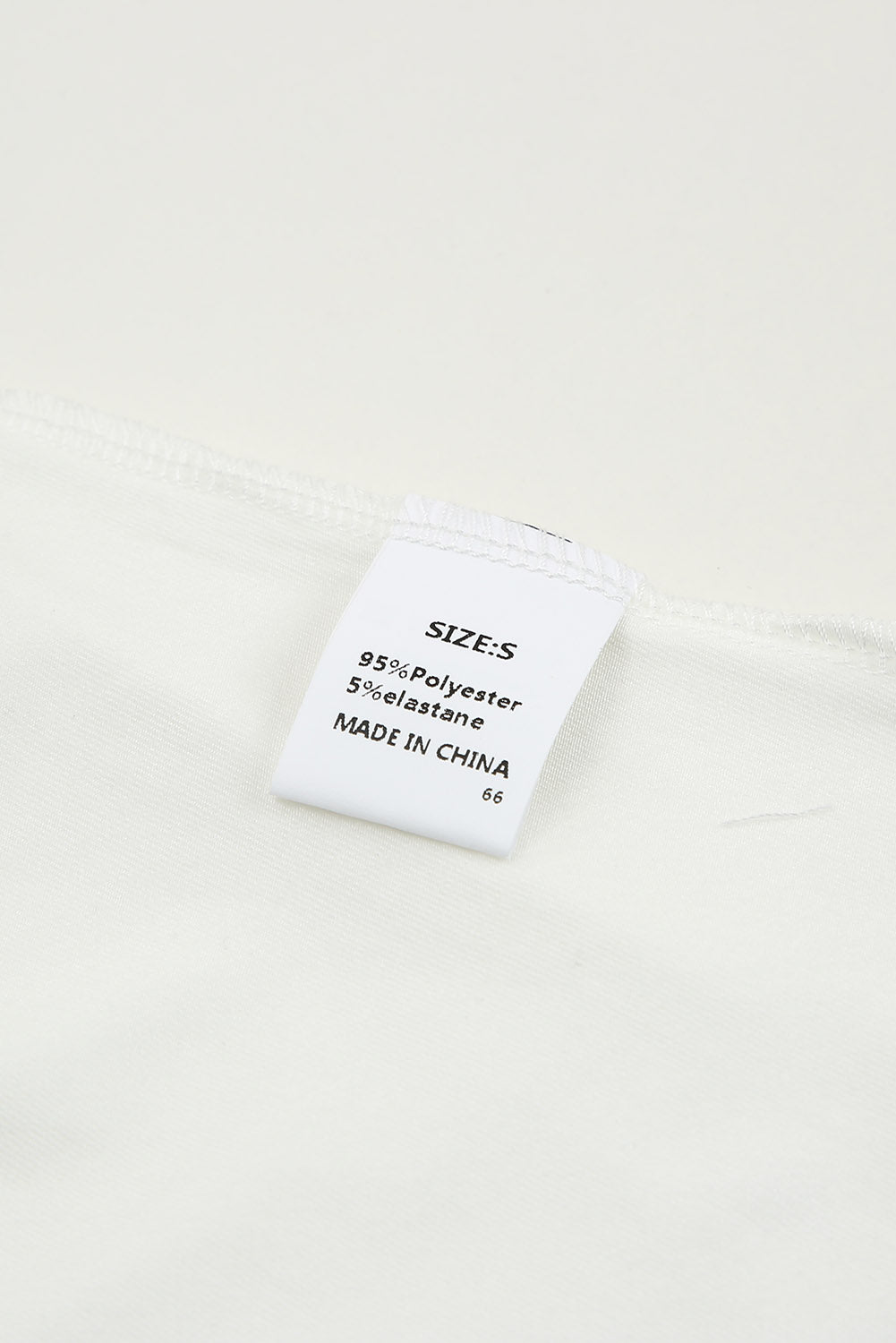 White lace-up hollow-out neck solid tank top showcasing a stylish design with a deep U-neck and sleeveless cut.