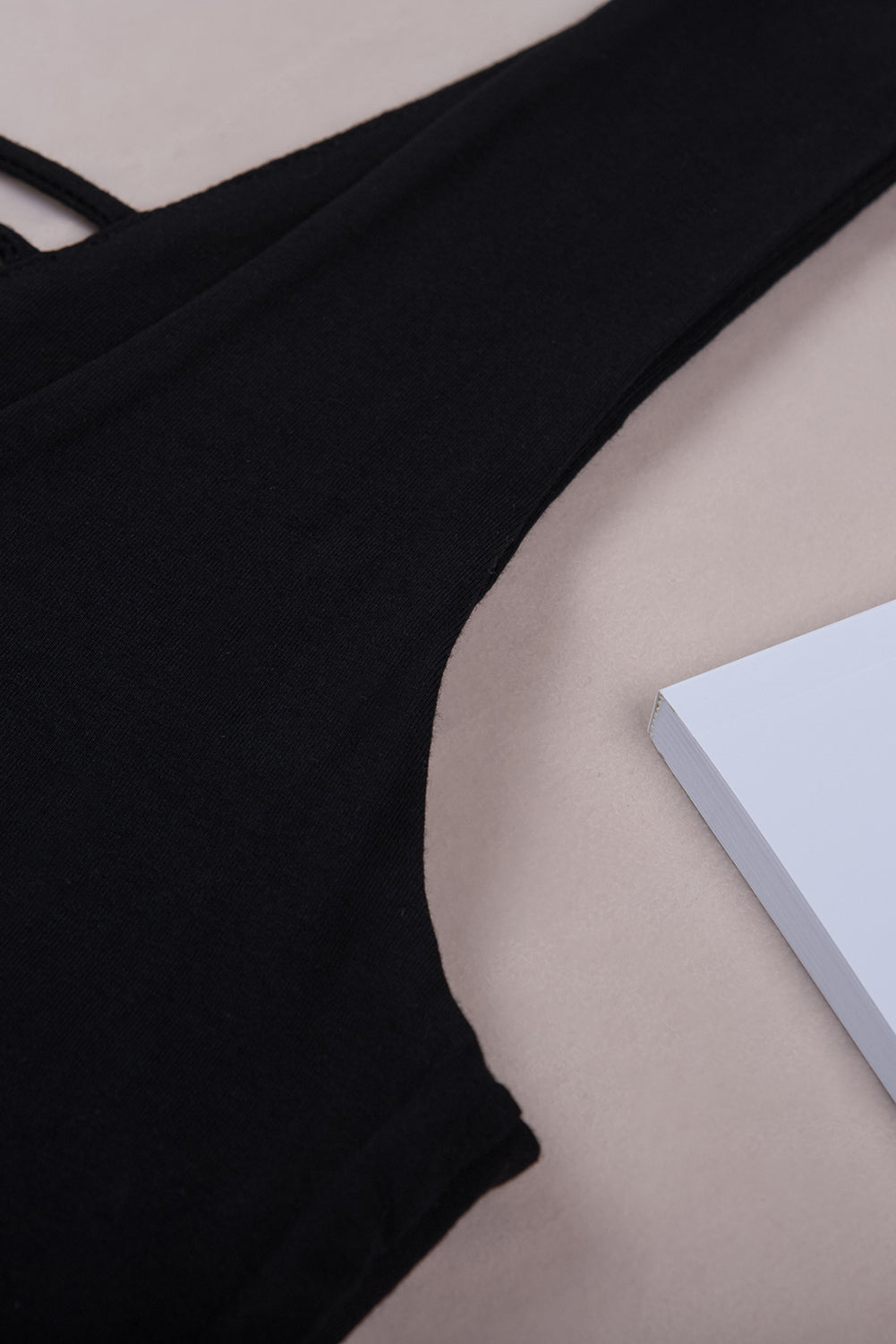 White lace-up hollow-out neck solid tank top showcasing a stylish design with a deep U-neck and sleeveless cut.