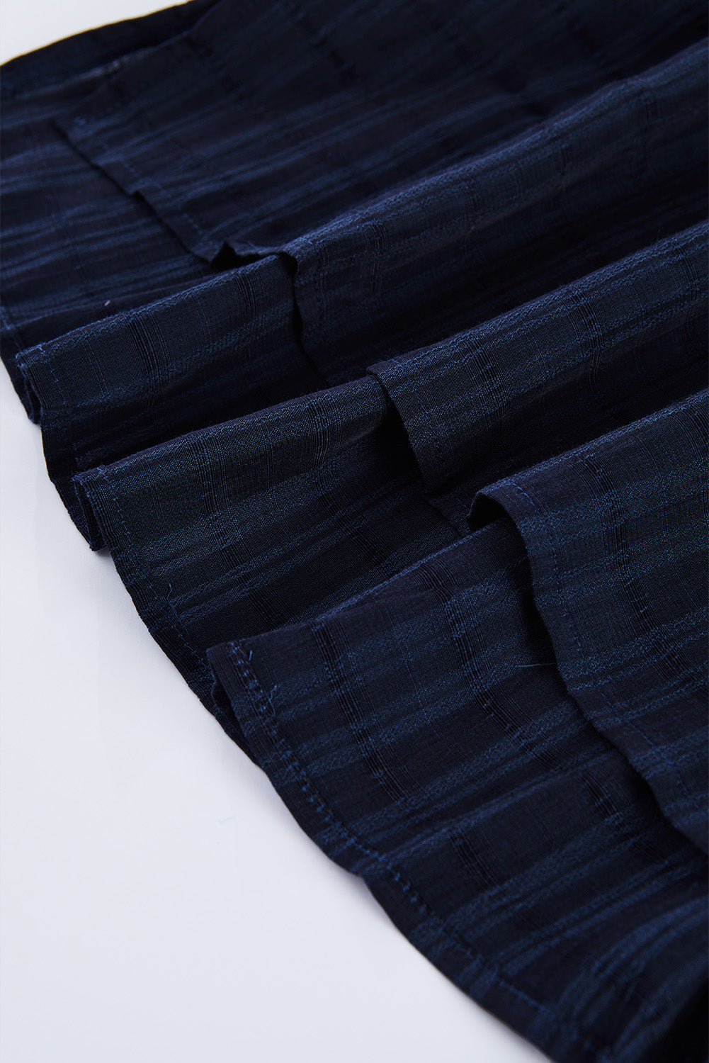 A stylish white plaid print loose V neck short sleeve shirt with slits, showcasing its trendy design and comfortable fit.